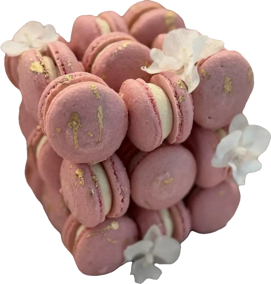 Pink macaron cake with white flowers